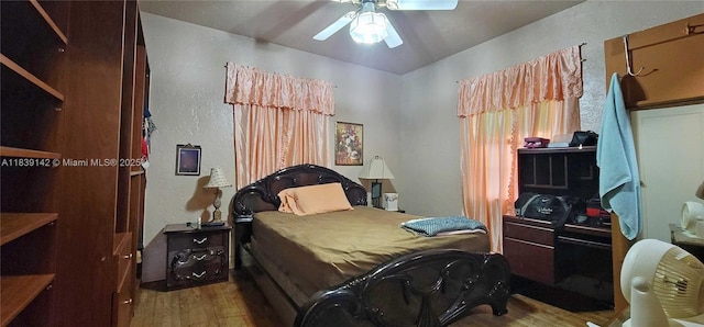 1824 SW 24th St, Miami, FL 33145 - bedroom featuring wood finished floors, a ceiling fan, and a textured wall