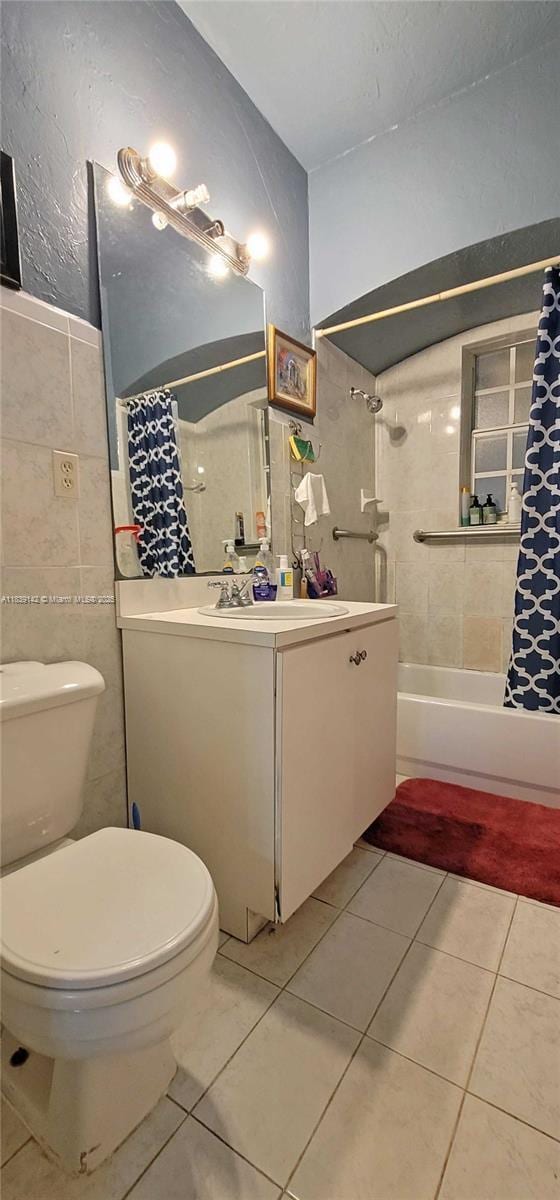 1824 SW 24th St, Miami, FL 33145 - full bath featuring vanity, tile patterned floors, shower / bath combo with shower curtain, tile walls, and a textured wall