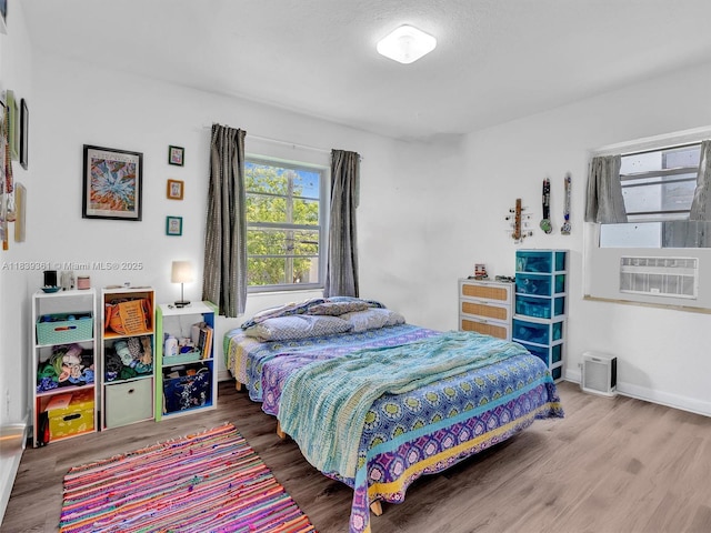 3210 E Elizabeth St, Miami, FL 33133 - bedroom featuring wood finished floors and cooling unit