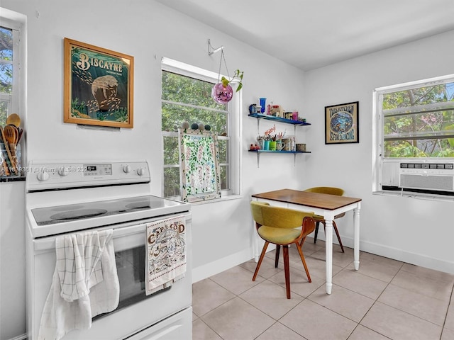 3210 E Elizabeth St, Miami, FL 33133 - kitchen with electric range, plenty of natural light, cooling unit, and light tile patterned floors