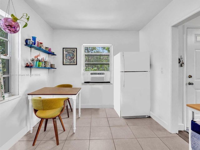 3210 E Elizabeth St, Miami, FL 33133 - kitchen with freestanding refrigerator, cooling unit, and light tile patterned floors