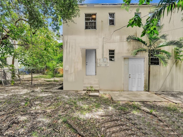 3210 E Elizabeth St, Miami, FL 33133 - rear view of property with stucco siding