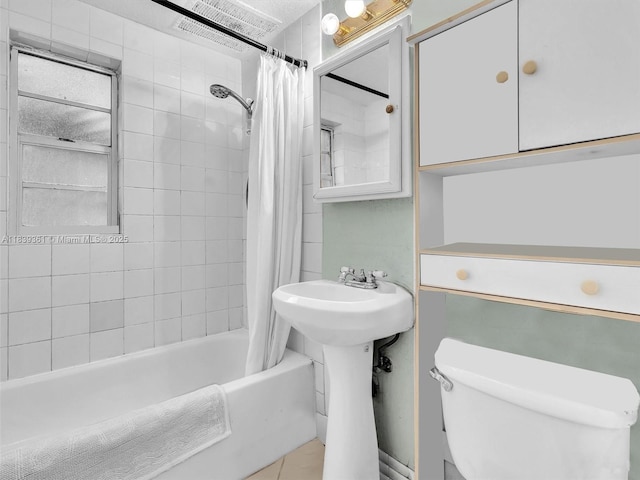 3210 E Elizabeth St, Miami, FL 33133 - bathroom with shower / bath combination with curtain and tile patterned floors