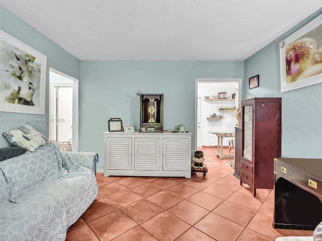3210 E Elizabeth St, Miami, FL 33133 - living area featuring light tile patterned floors and a textured ceiling
