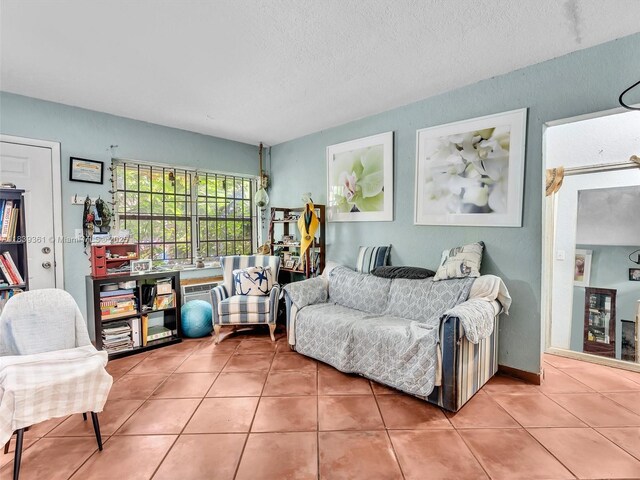 3210 E Elizabeth St, Miami, FL 33133 - tiled living room with a textured ceiling