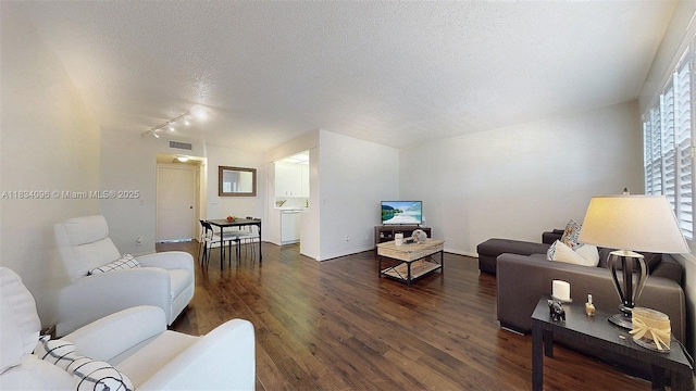 4047 Rexford C Unit 4047, Boca Raton, FL 33434 - living room featuring a textured ceiling, wood finished floors, and track lighting