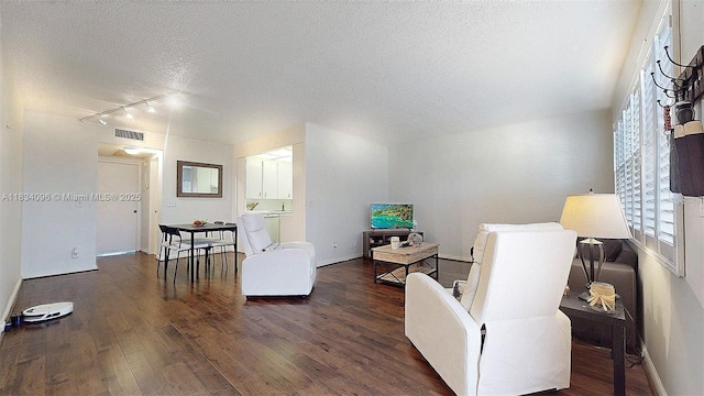 4047 Rexford C Unit 4047, Boca Raton, FL 33434 - living room featuring a textured ceiling, track lighting, and dark wood-style flooring