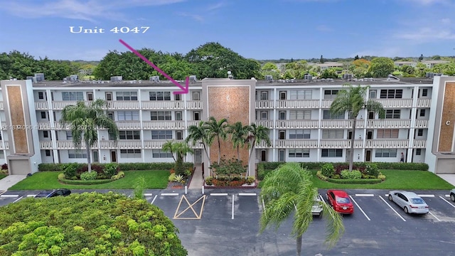 4047 Rexford C Unit 4047, Boca Raton, FL 33434 - view of apartment building / complex featuring uncovered parking