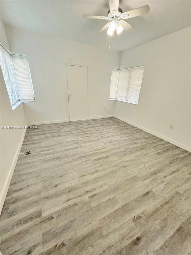 539 NE 82nd Ter, Miami, FL 33138 - empty room with wood finished floors and a ceiling fan