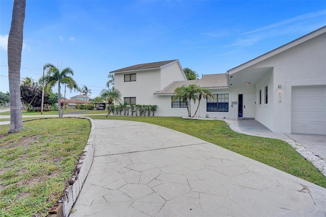 614 SE 12th Ave, Deerfield Beach, FL 33441 - view of front of house with stucco siding and a front lawn