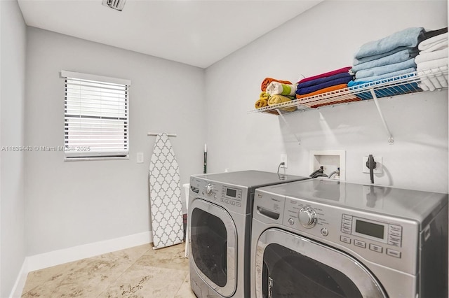 614 SE 12th Ave, Deerfield Beach, FL 33441 - laundry area with separate washer and dryer and baseboards