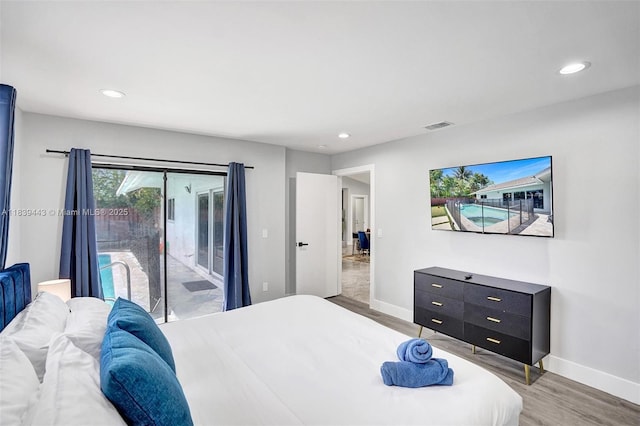 614 SE 12th Ave, Deerfield Beach, FL 33441 - bedroom with access to exterior, light wood-style floors, and recessed lighting