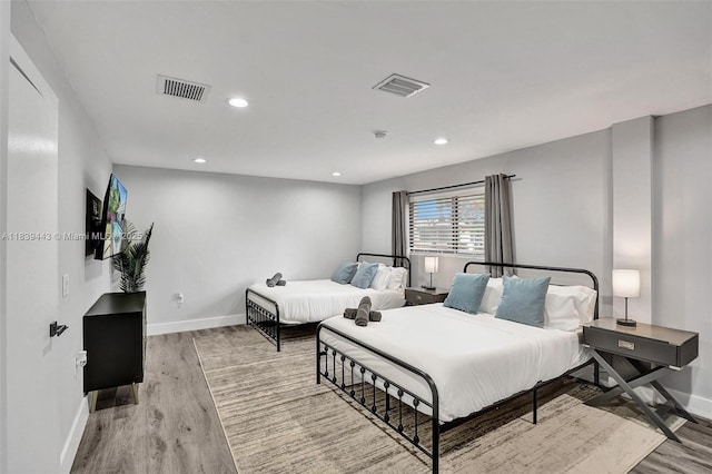 614 SE 12th Ave, Deerfield Beach, FL 33441 - bedroom with light wood-style flooring and recessed lighting