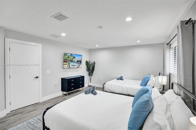 614 SE 12th Ave, Deerfield Beach, FL 33441 - bedroom with light wood finished floors and recessed lighting