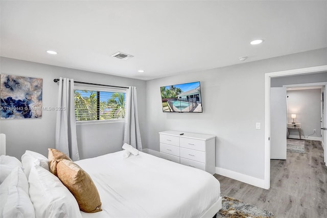 614 SE 12th Ave, Deerfield Beach, FL 33441 - bedroom featuring light wood finished floors and recessed lighting