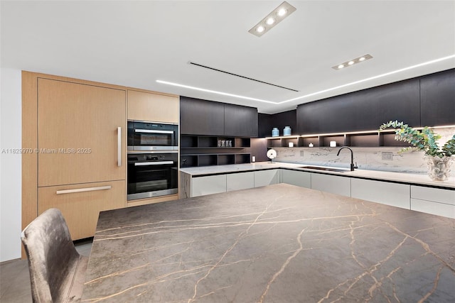 2301 Collins Ave Unit 1004/1003, Miami Beach, FL 33139 - kitchen featuring open shelves, dark stone countertops, double oven, and modern cabinets