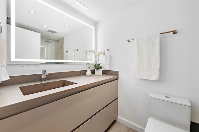 2301 Collins Ave Unit 1004/1003, Miami Beach, FL 33139 - bathroom with vanity, tiled shower, and tile patterned floors