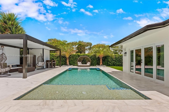 8115 NW 185th Ter, Hialeah, FL 33015 - swimming pool featuring french doors and a patio
