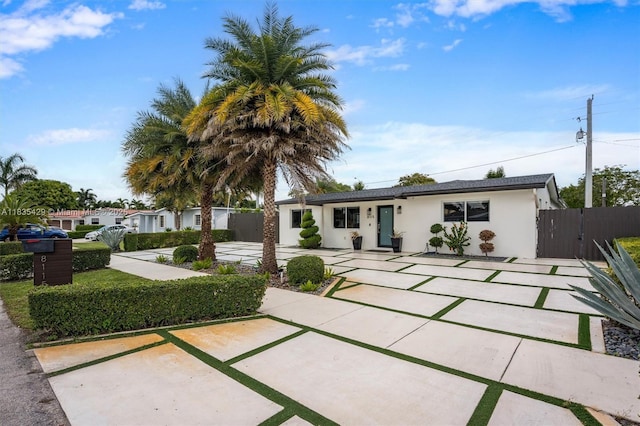 8115 NW 185th Ter, Hialeah, FL 33015 - single story home with stucco siding and a gate