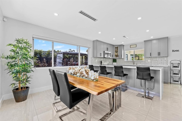 8115 NW 185th Ter, Hialeah, FL 33015 - dining area with healthy amount of natural light and recessed lighting