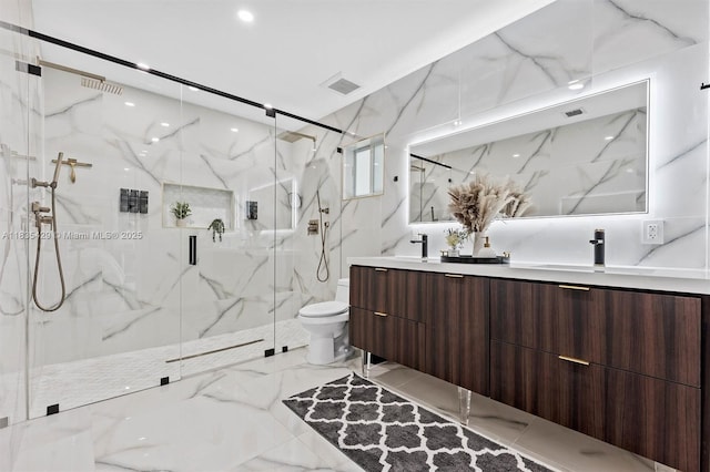 8115 NW 185th Ter, Hialeah, FL 33015 - bathroom with double vanity, a marble finish shower, and marble tiled flooring