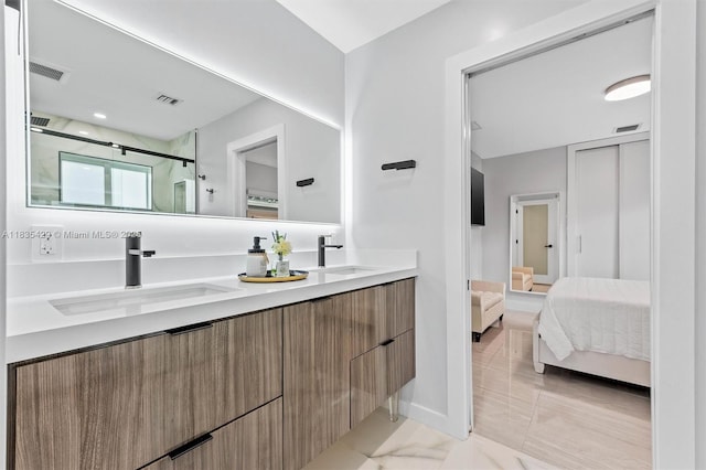 8115 NW 185th Ter, Hialeah, FL 33015 - ensuite bathroom with double vanity, a stall shower, and marble finish floors