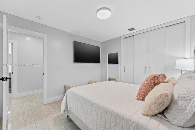8115 NW 185th Ter, Hialeah, FL 33015 - bedroom featuring a closet and baseboards