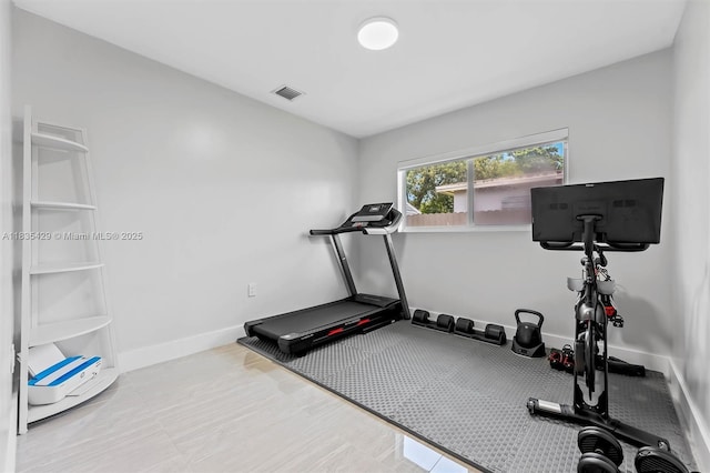 8115 NW 185th Ter, Hialeah, FL 33015 - workout room featuring baseboards