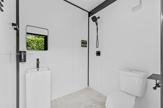 8115 NW 185th Ter, Hialeah, FL 33015 - bathroom featuring marble look tile flooring and a shower