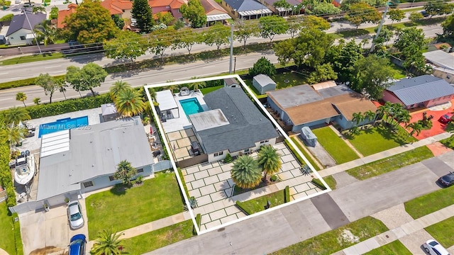 8115 NW 185th Ter, Hialeah, FL 33015 - aerial view of residential area with a pool area and property boundaries highlighted