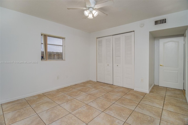 9443 SW 174th St Unit 9443, Palmetto Bay, FL 33157 - unfurnished bedroom with light tile patterned floors, a closet, and ceiling fan