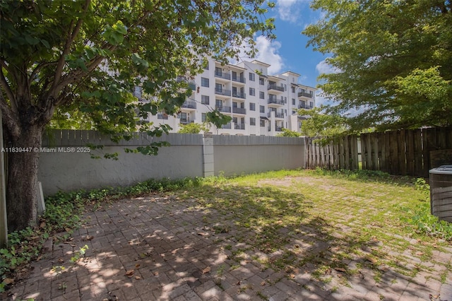 9443 SW 174th St Unit 9443, Palmetto Bay, FL 33157 - fenced backyard with a patio area
