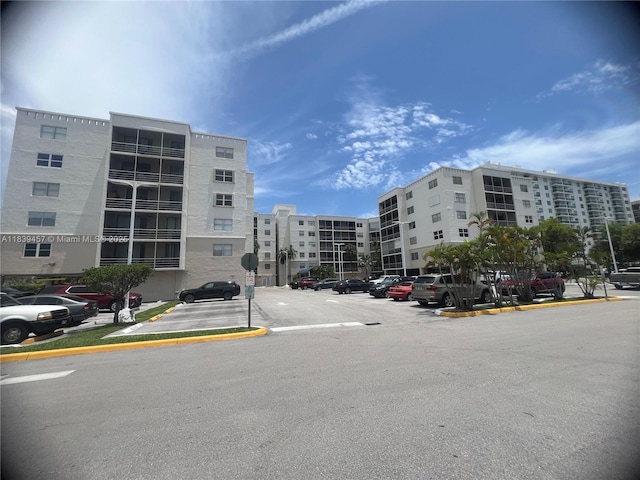 2821 N Miami Beach Blvd Unit 2E, North Miami Beach, FL 33160 - view of apartment building / complex with uncovered parking