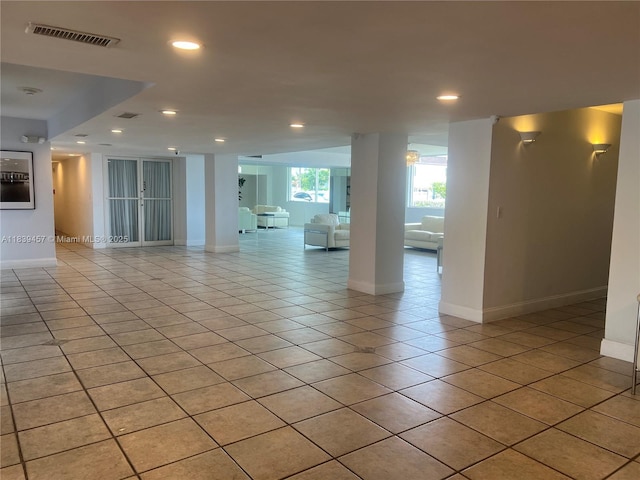 2821 N Miami Beach Blvd Unit 2E, North Miami Beach, FL 33160 - empty room featuring light tile patterned floors and recessed lighting