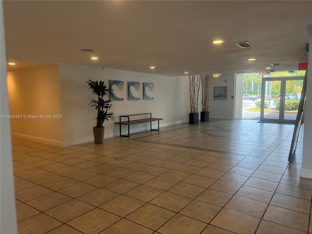 2821 N Miami Beach Blvd Unit 2E, North Miami Beach, FL 33160 - empty room featuring light tile patterned flooring and recessed lighting