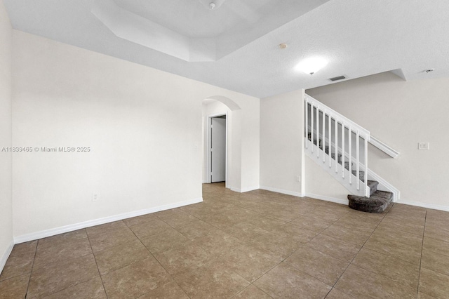 3066 S Red Mangrove Ln S Unit 201-2, Dania Beach, FL 33312 - tiled spare room with arched walkways and stairs
