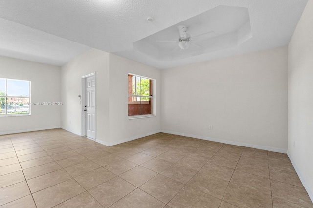 3066 S Red Mangrove Ln S Unit 201-2, Dania Beach, FL 33312 - spare room with ceiling fan, light tile patterned flooring, and a raised ceiling