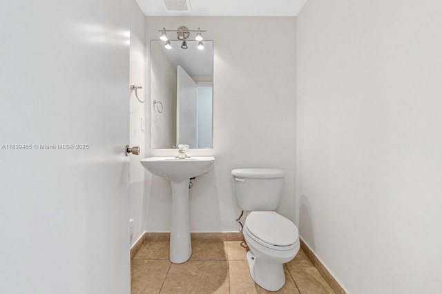 3066 S Red Mangrove Ln S Unit 201-2, Dania Beach, FL 33312 - half bath with toilet and tile patterned floors