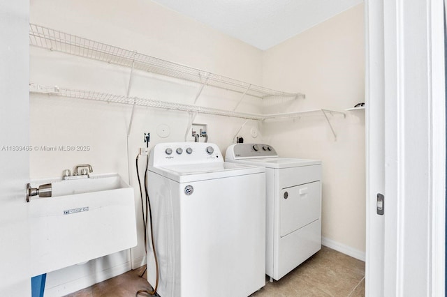 3066 S Red Mangrove Ln S Unit 201-2, Dania Beach, FL 33312 - laundry area featuring washing machine and clothes dryer and light tile patterned flooring