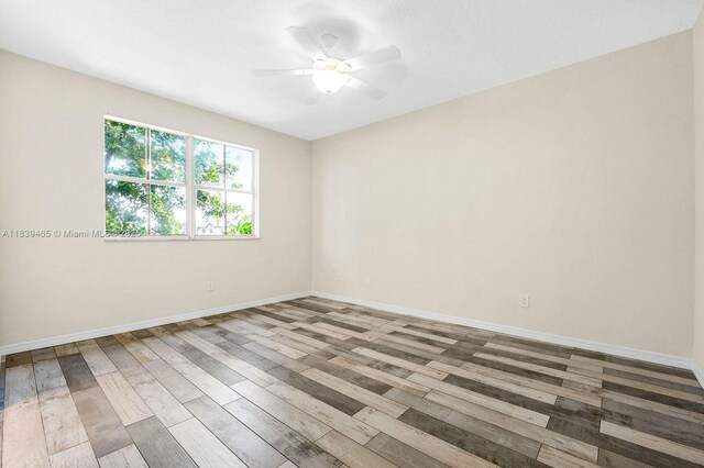 3066 S Red Mangrove Ln S Unit 201-2, Dania Beach, FL 33312 - empty room with wood finished floors and ceiling fan