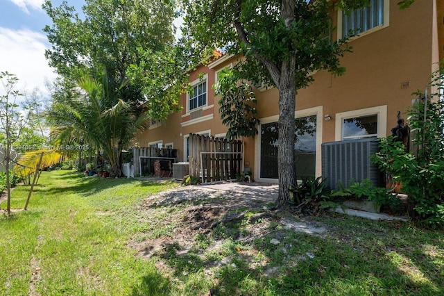 3066 S Red Mangrove Ln S Unit 201-2, Dania Beach, FL 33312 - back of house featuring stucco siding