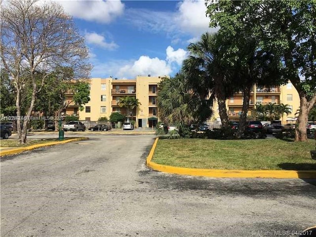 5755 W 20th Ave Unit 206, Hialeah, FL 33012 - view of property featuring uncovered parking