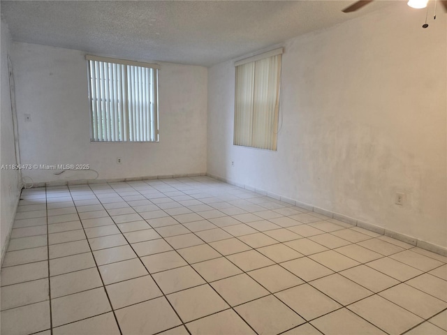 5755 W 20th Ave Unit 206, Hialeah, FL 33012 - empty room featuring light tile patterned floors, a textured ceiling, and ceiling fan