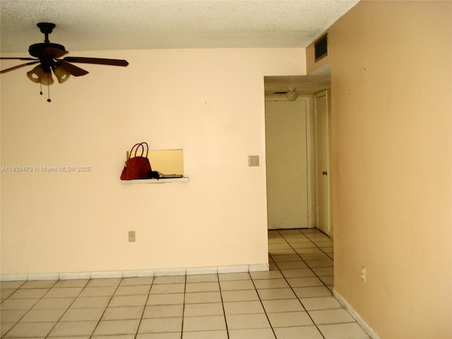 5755 W 20th Ave Unit 206, Hialeah, FL 33012 - spare room featuring ceiling fan, light tile patterned floors, and a textured ceiling