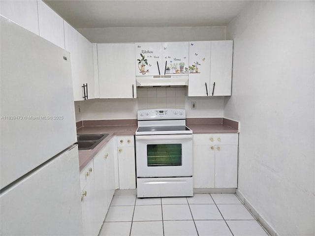 5755 W 20th Ave Unit 206, Hialeah, FL 33012 - kitchen featuring white appliances, under cabinet range hood, white cabinets, and light tile patterned flooring