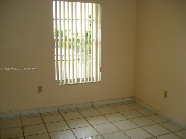 5755 W 20th Ave Unit 206, Hialeah, FL 33012 - tiled empty room featuring healthy amount of natural light