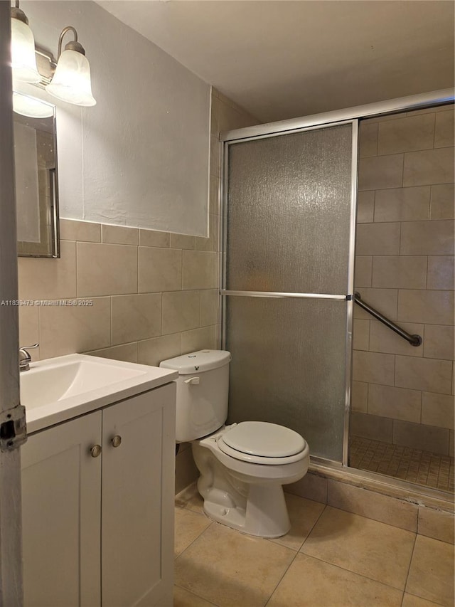 5755 W 20th Ave Unit 206, Hialeah, FL 33012 - full bath featuring a shower stall, vanity, tile patterned flooring, and tile walls