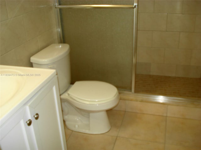 5755 W 20th Ave Unit 206, Hialeah, FL 33012 - bathroom featuring vanity, a stall shower, and tile patterned flooring
