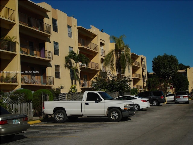 5755 W 20th Ave Unit 206, Hialeah, FL 33012 - view of apartment building / complex featuring uncovered parking