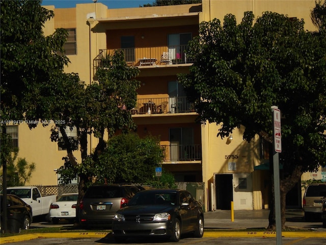 5755 W 20th Ave Unit 206, Hialeah, FL 33012 - view of building exterior featuring uncovered parking